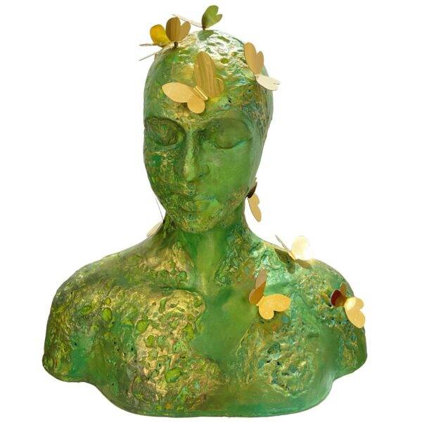 Trilokini 14 — mixed media figurative female bust sculpture by Romicon Revola with heavily textured green and gold surface and brass butterfly elements throughout, front view.