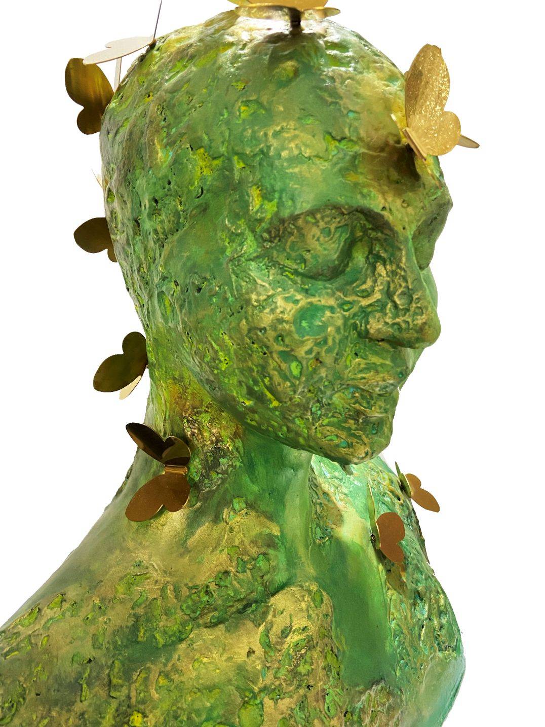 Trilokini 14 — mixed media figurative female bust sculpture by Romicon Revola with heavily textured green and gold surface and brass butterfly elements throughout, front view.